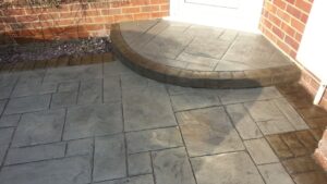Platinum Grey Grand Ashlar Printed Concrete Driveway with Acid-Stained Borders