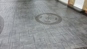 Platinum Grey Grand Ashlar Printed Concrete Driveway with Etched Borders and Compass Feature