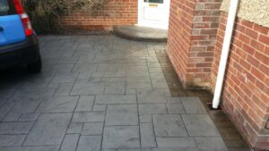 Platinum Grey Grand Ashlar Printed Concrete Driveway with Acid-Stained Borders