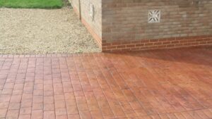 Brick Red and Rustic Sandstone London Cobble Printed Concrete Driveway