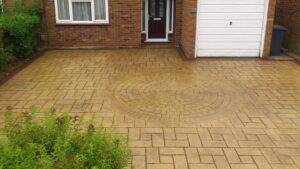 Bideford Buff Riverside Slate and Cobble Feature Printed Concrete Driveway with Mahogany Stained Borders