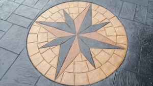 Printed Concrete Cobble Star Feature in Caesar Stone Driveway
