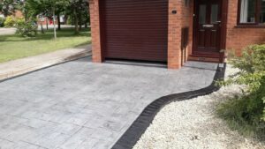 Printed Concrete Driveway by DCS in Platinum Grey Ashlar Slate with Charcoal Release and Black Borders
