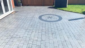 DCS Printed Concrete Patio in Platinum Grey London Cobble with a Compass Feature Circle